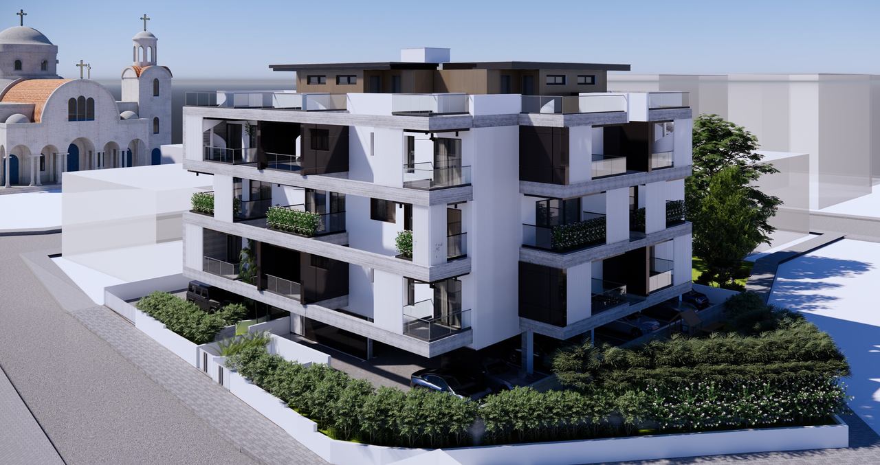 White modern residential apartment building with landscaped garden frontage